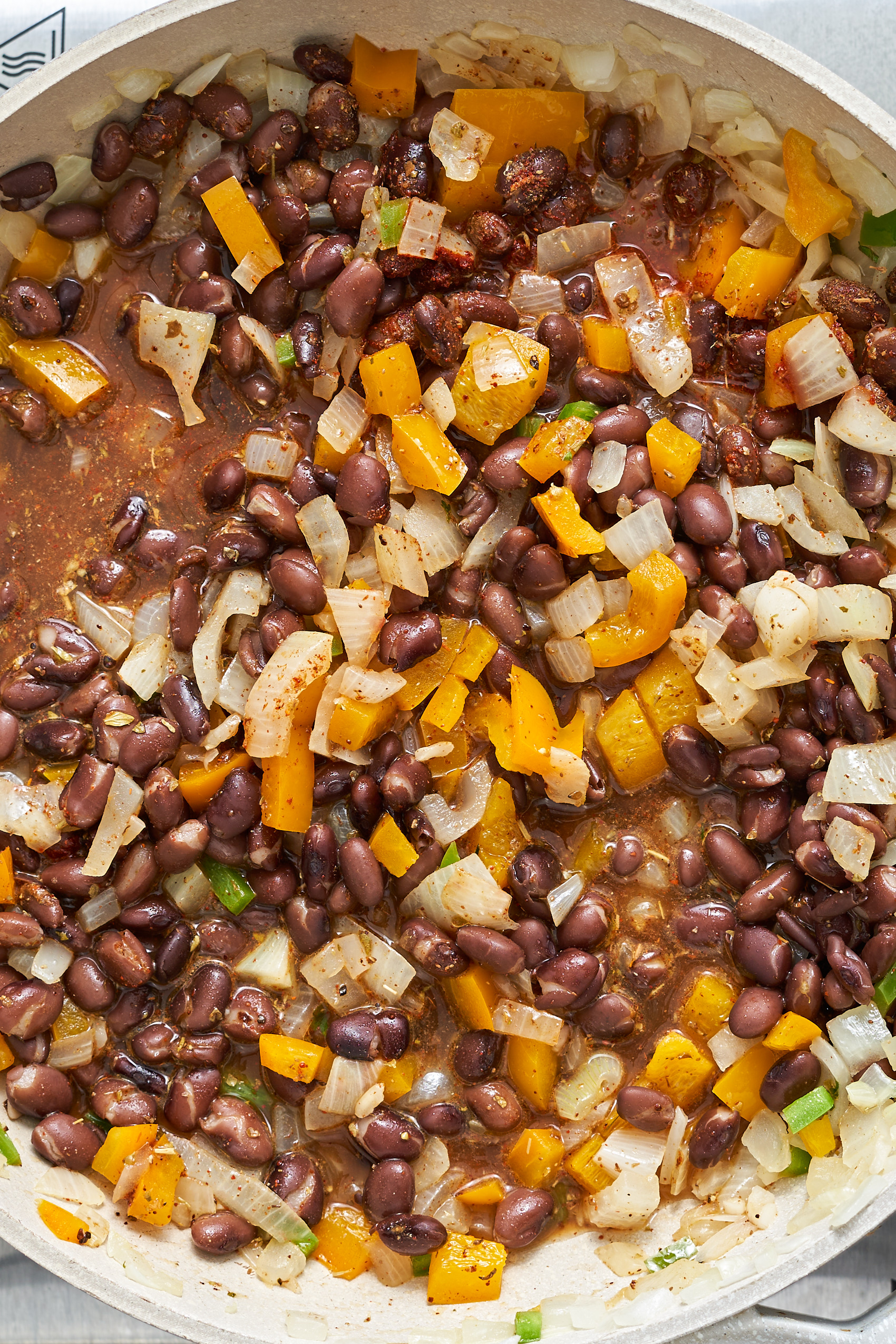 a close up of a pot of cooked black beans
