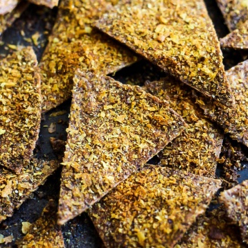 Enjoy the cheesy, crispy snack you love in a healthier way by making these Easy Baked Vegan Doritos! They're a great flavorful snack or party finger food.