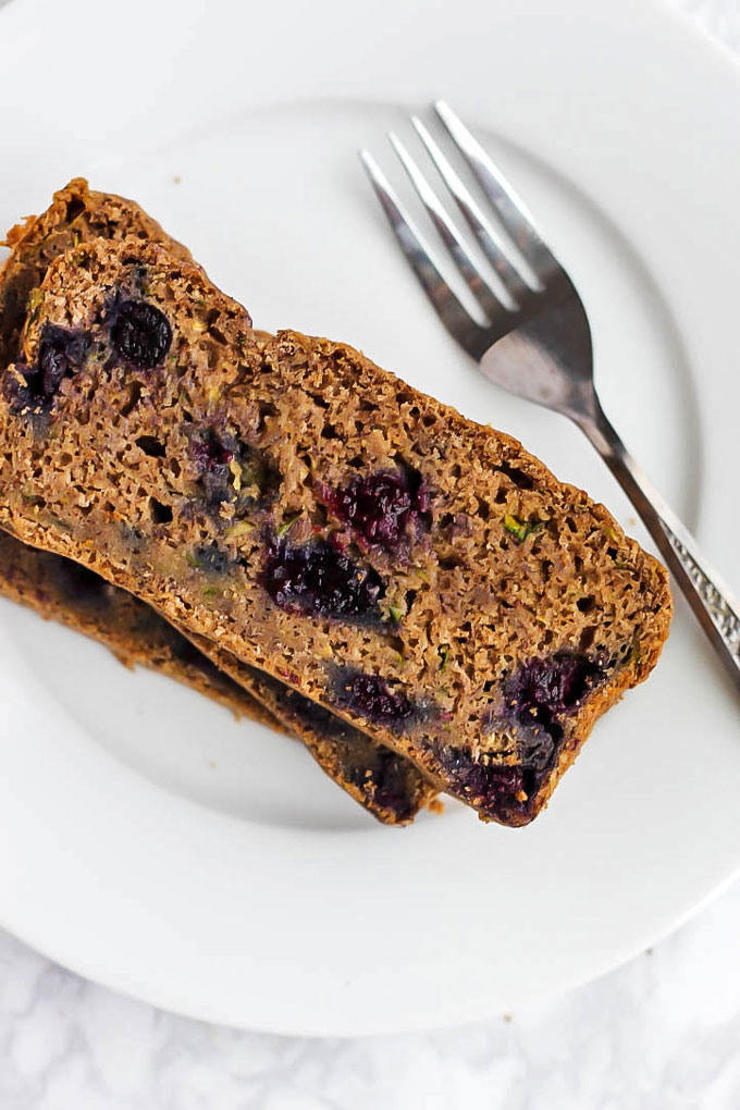 Enjoy this whole-grain Vegan Blueberry Zucchini Bread for a nutritious breakfast or dessert! It's packed with zucchini, blueberries & wholesome ingredients. Plus, six other vegan recipes using delicious blueberries that you'll love.