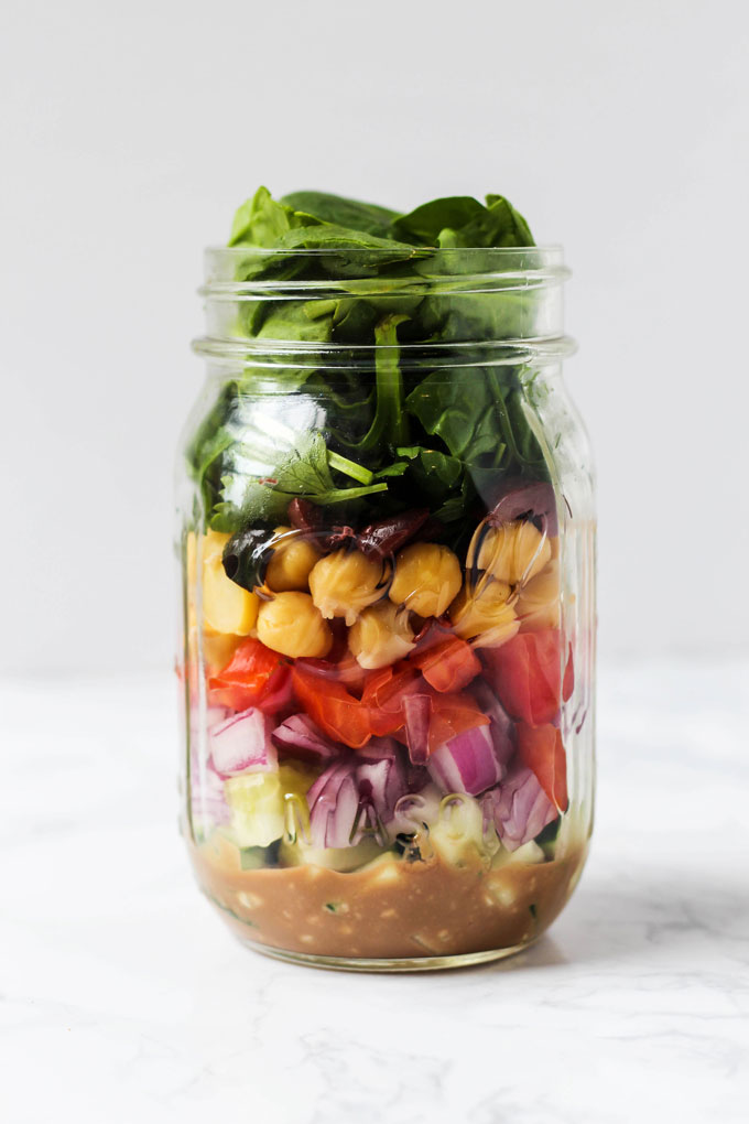 Pack one of these 5 vegan mason jar salad recipes for a healthy lunch on-the-go! They're easy to assemble ahead of time & full of nutritious ingredients.