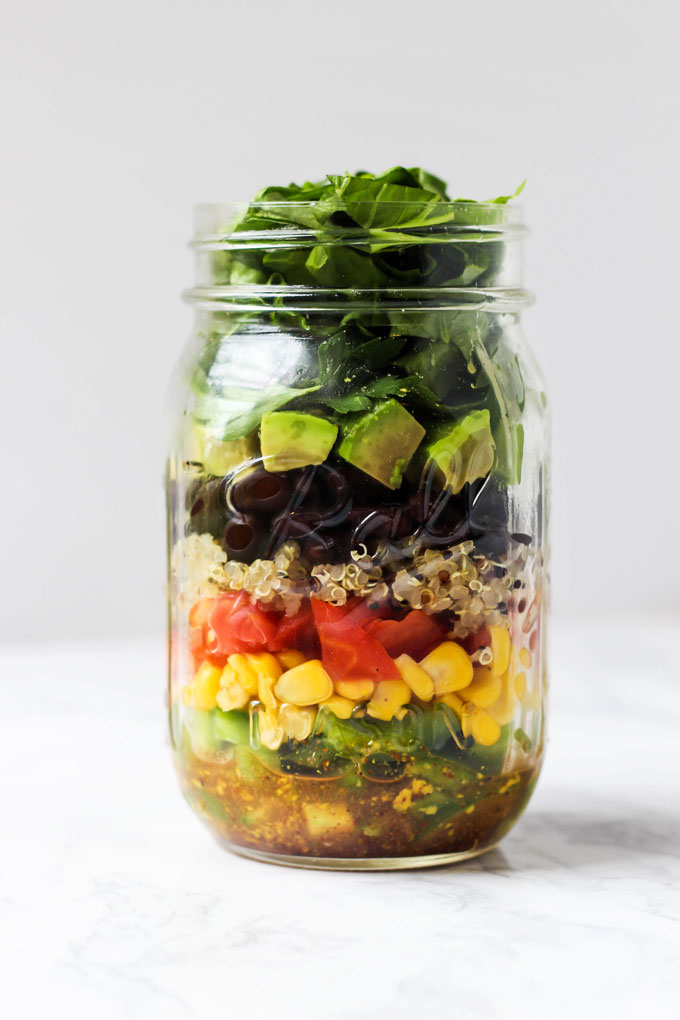 Pack one of these 5 vegan mason jar salad recipes for a healthy lunch on-the-go! They're easy to assemble ahead of time & full of nutritious ingredients.