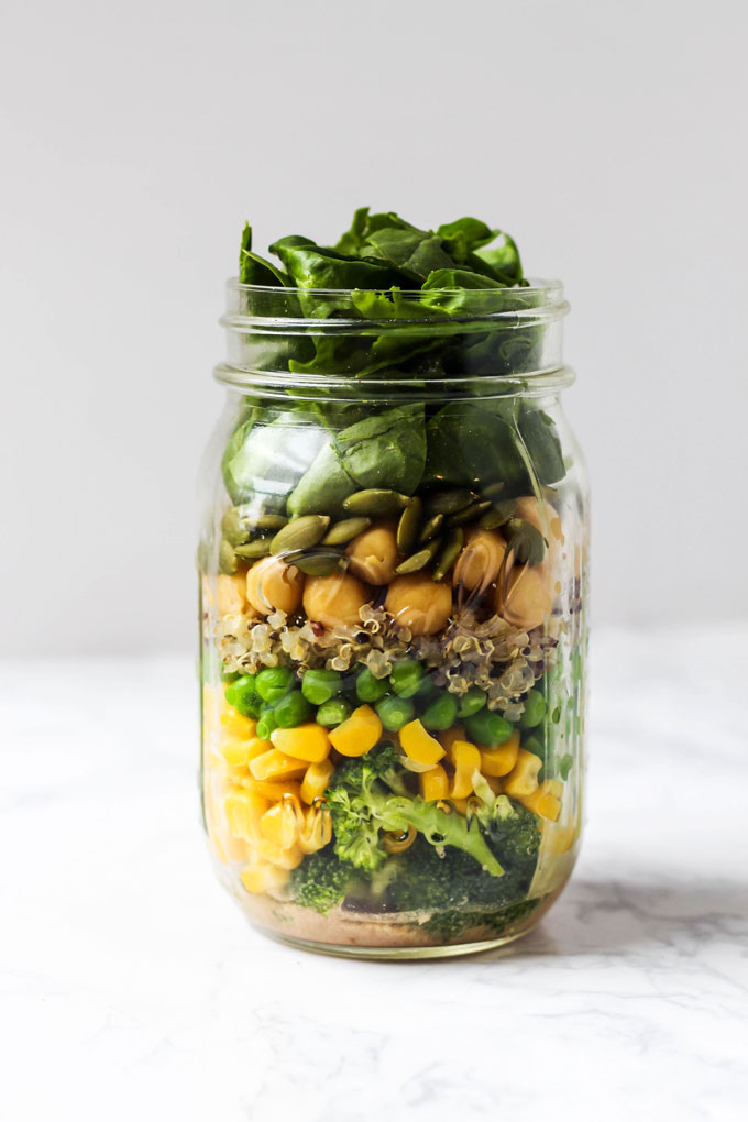 Pack one of these 5 vegan mason jar salad recipes for a healthy lunch on-the-go! They're easy to assemble ahead of time & full of nutritious ingredients.