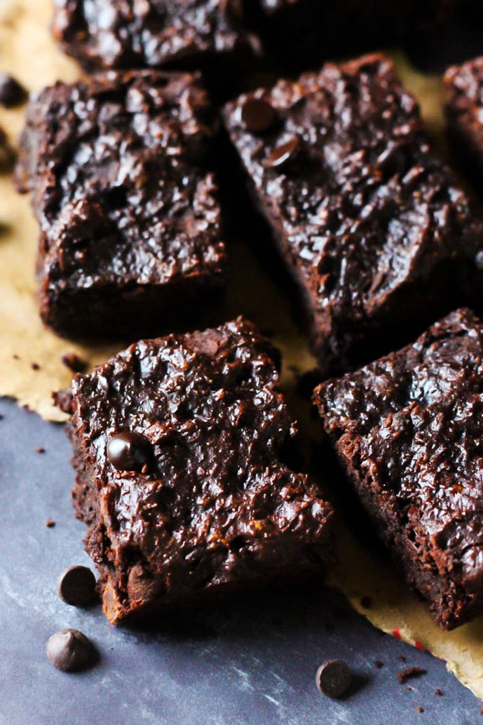 These Chocolate Chip Almond Butter Brownies taste like a decadent dessert, but they're also vegan, gluten-free & date-sweetened! Rich, fudgy & satisfying.