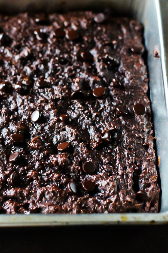 These Chocolate Chip Almond Butter Brownies taste like a decadent dessert, but they're also vegan, gluten-free & date-sweetened! Rich, fudgy & satisfying.