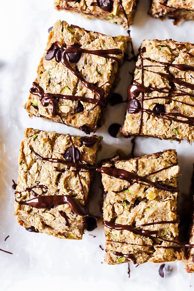 four breakfast bars topped with a drizzle of chocolate