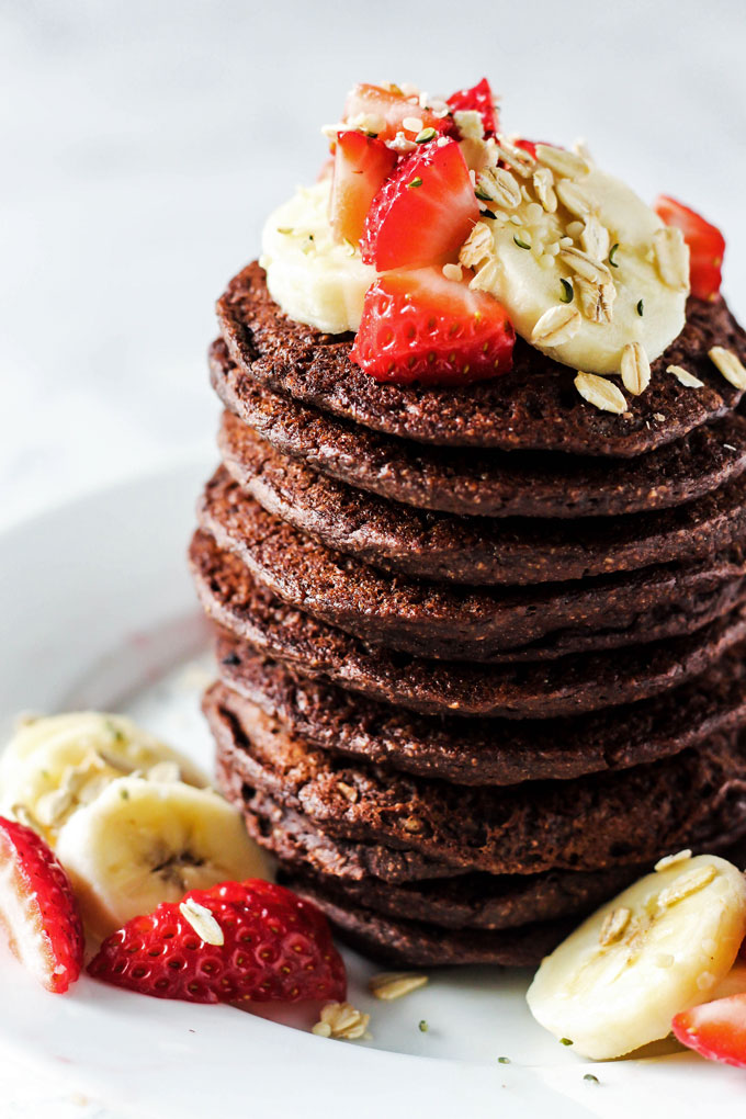 These easy Chocolate Banana Oatmeal Pancakes are made in the blender from wholesome ingredients! A healthy way to curb your morning sweet tooth. Vegan & GF!