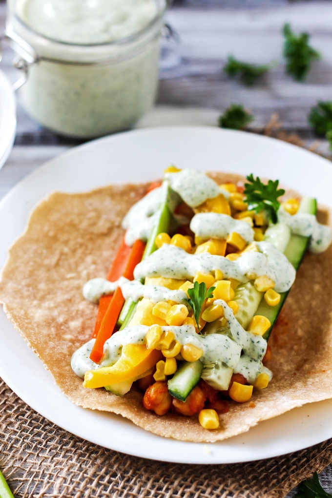 A smoky, savory Vegan BBQ Chickpea Wrap is the perfect lunch to pack for work or school! Stuff it with fresh vegetables for a healthy, satisfying meal.