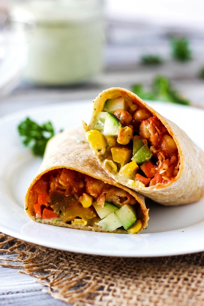 A smoky, savory Vegan BBQ Chickpea Wrap is the perfect lunch to pack for work or school! Stuff it with fresh vegetables for a healthy, satisfying meal.