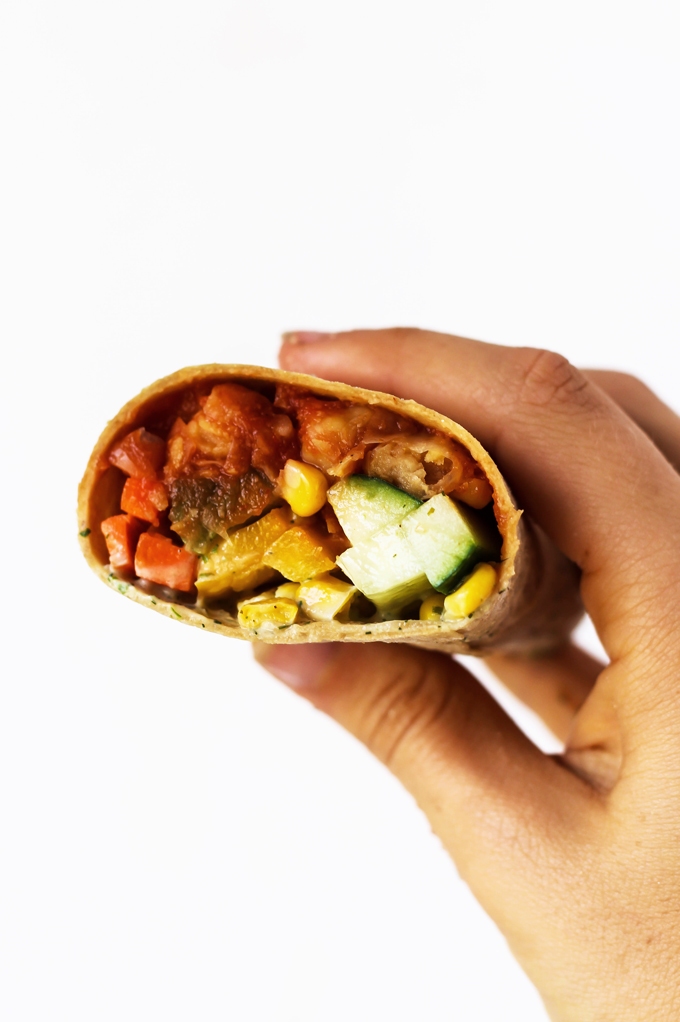 A smoky, savory Vegan BBQ Chickpea Wrap is the perfect lunch to pack for work or school! Stuff it with fresh vegetables for a healthy, satisfying meal.