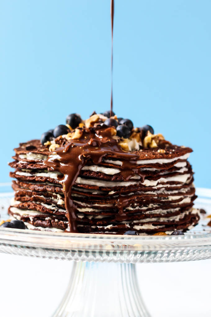 This Chocolate Crepe Cake is sure to stand out at any party! Made with wholesome ingredients, this vegan & gluten-free cake is a healthier way to indulge.