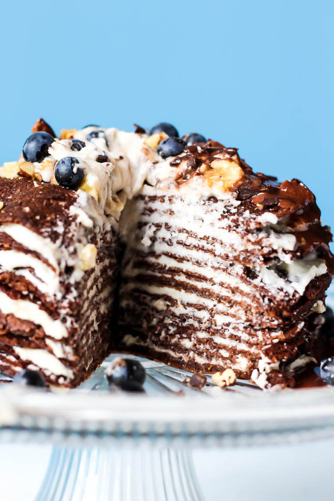 This Chocolate Crepe Cake is sure to stand out at any party! Made with wholesome ingredients, this vegan & gluten-free cake is a healthier way to indulge.