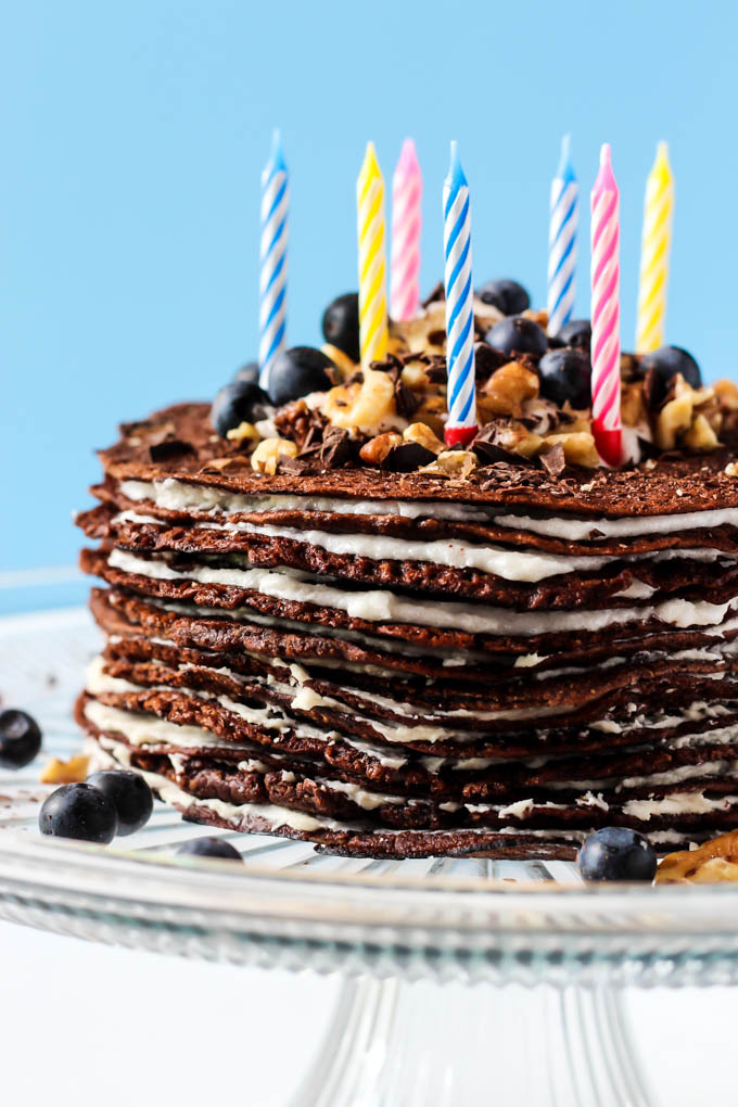 This Chocolate Crepe Cake is sure to stand out at any party! Made with wholesome ingredients, this vegan & gluten-free cake is a healthier way to indulge.