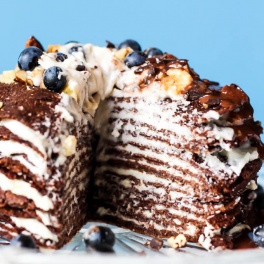 This Chocolate Crepe Cake is sure to stand out at any party! Made with wholesome ingredients, this vegan & gluten-free cake is a healthier way to indulge.