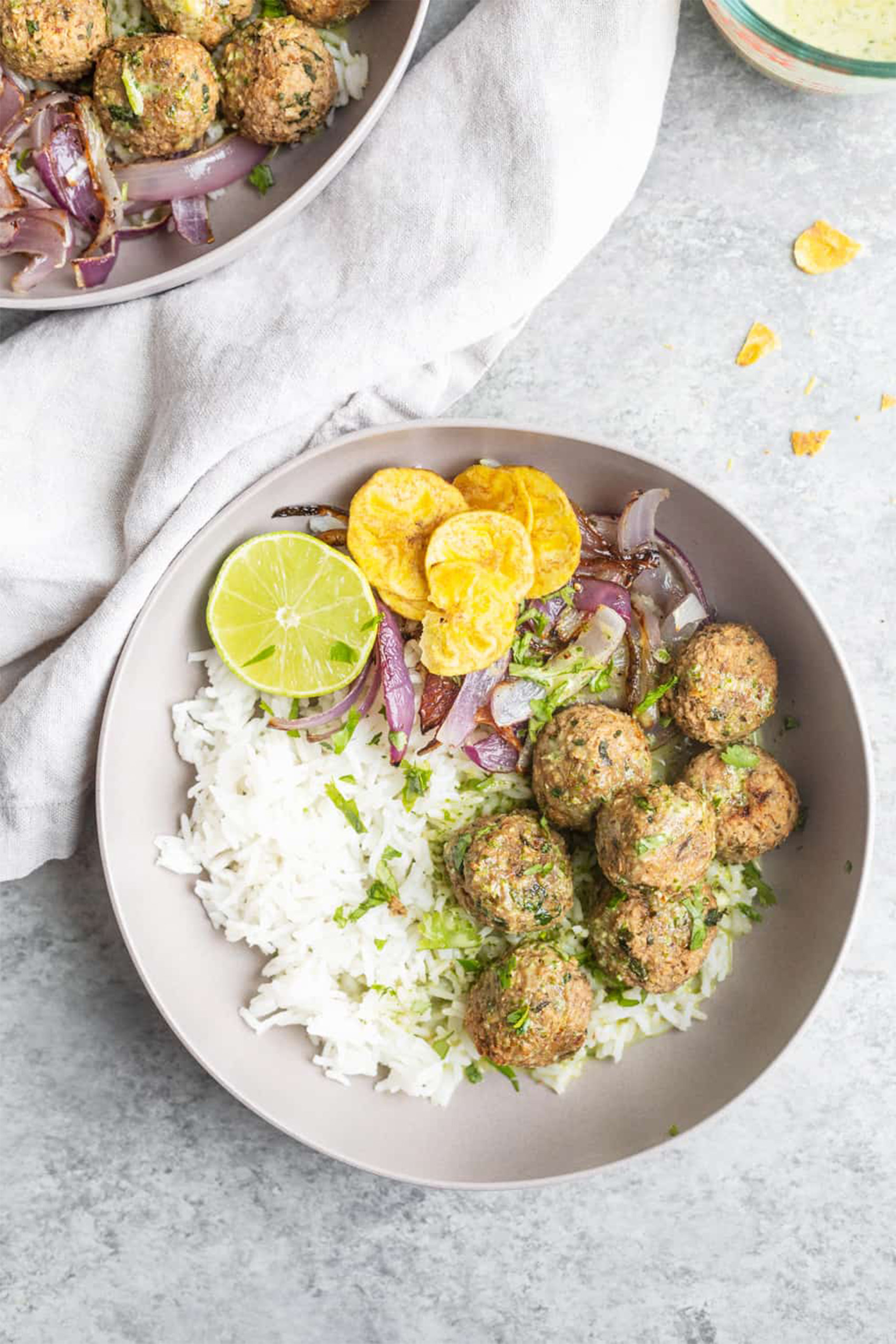 white bean walnut meat balls served over white rice with a mojo sauce