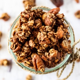 Enjoy the warming flavors in this chunky Chai Spice Granola! It's full of oats & nuts without oil, plus it's completely date-sweetened. Vegan & gluten-free!