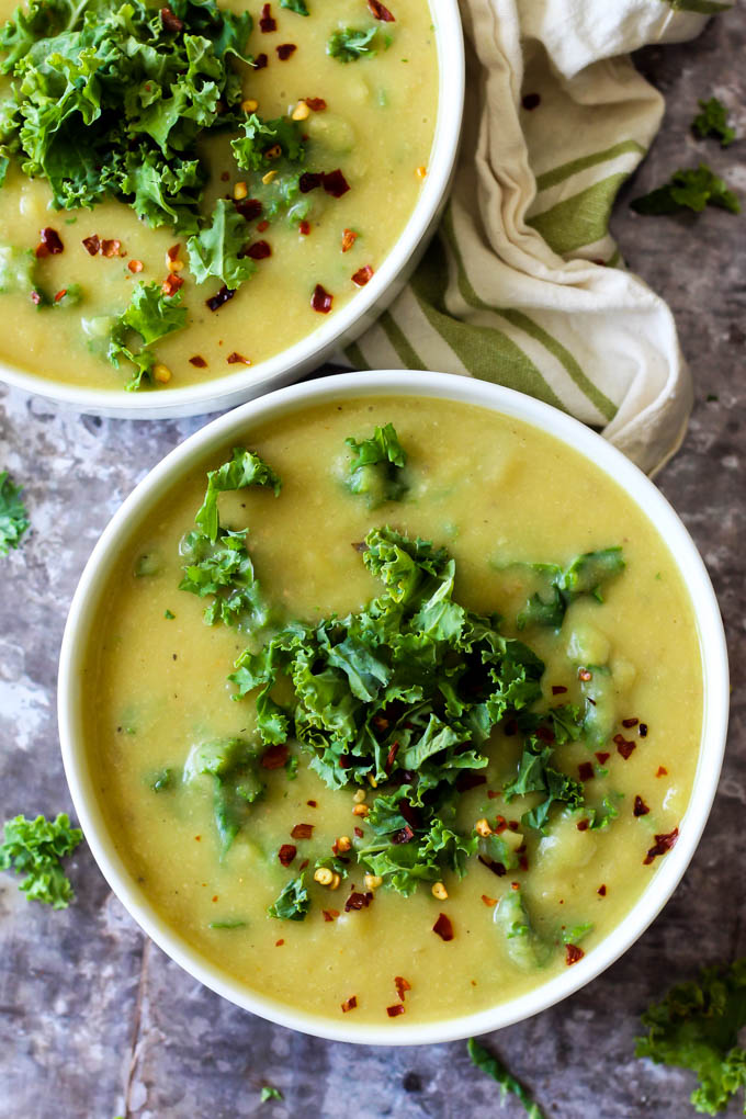 two bowls of potato kale soup