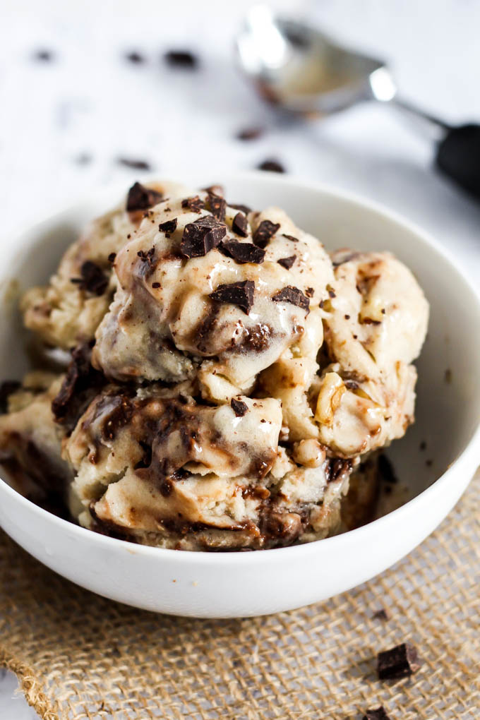 A bowl of homemade vegan ice cream filled with vegan brownie bits