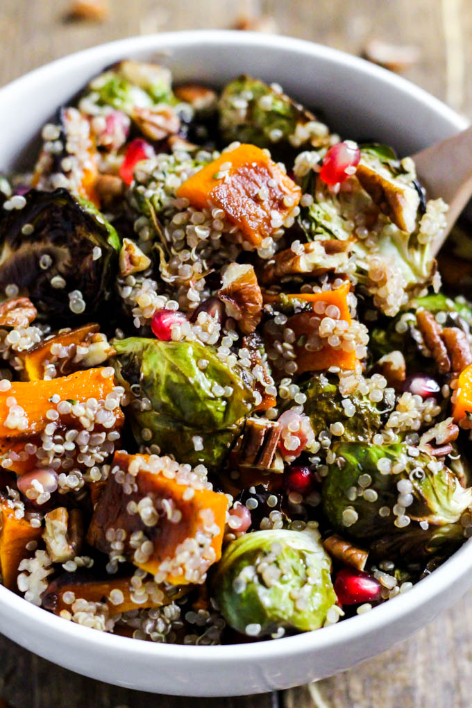 a quinoa salad with fall veggies topped with pecans