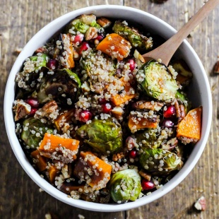a bowl of warm fall quinoa salad