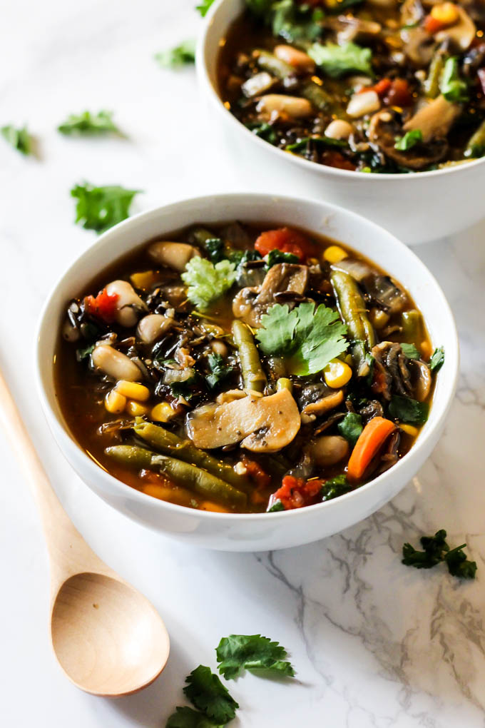 two bowls of vegetable soup with wild rice