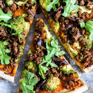 Put a twist on pizza night by making this Hearty Vegan Butternut Squash Pizza loaded with vegetables! It is full of plant protein, flavorful & whole wheat.
