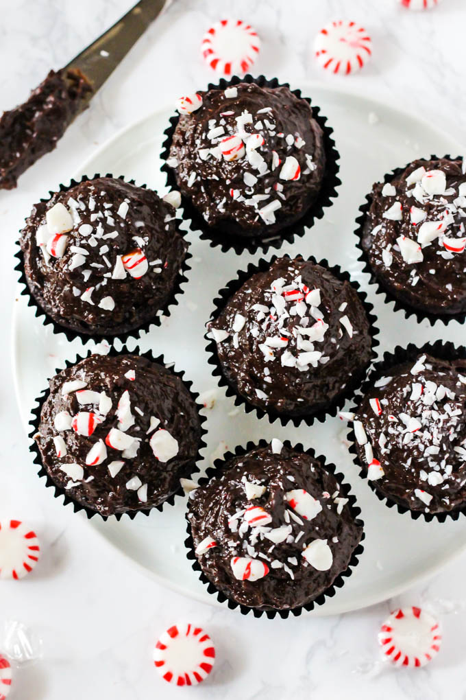 an overhead shot of a plate of chocolate peppermint cupcakes