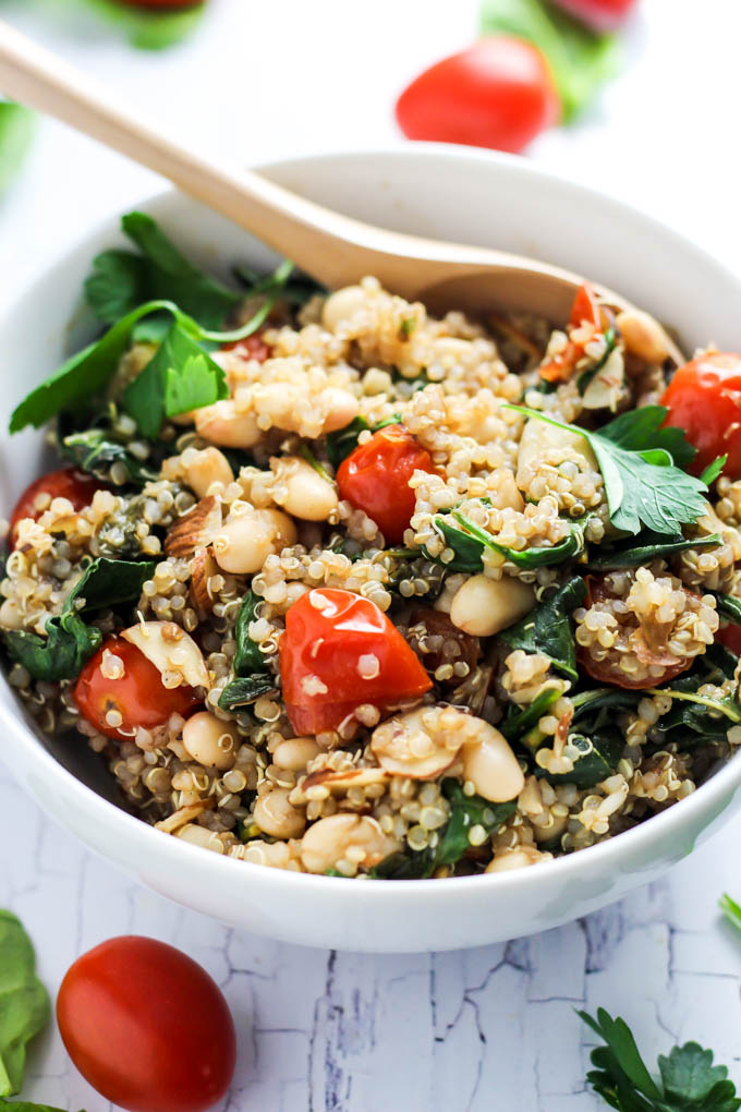 Complete your dinner with this Easy Quinoa Salad with Tomatoes & Spinach as a healthy side dish! It's vegan, gluten-free, and also makes a great lunch.