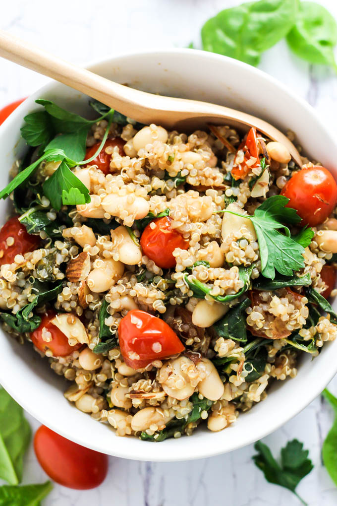 Complete your dinner with this Easy Quinoa Salad with Tomatoes & Spinach as a healthy side dish! It's vegan, gluten-free, and also makes a great lunch.