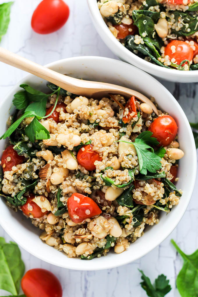 Complete your dinner with this Easy Quinoa Salad with Tomatoes & Spinach as a healthy side dish! It's vegan, gluten-free, and also makes a great lunch.