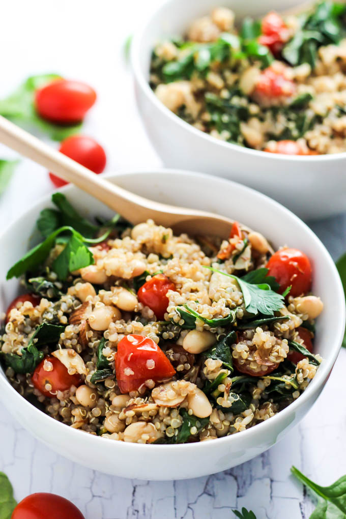 Complete your dinner with this Easy Quinoa Salad with Tomatoes & Spinach as a healthy side dish! It's vegan, gluten-free, and also makes a great lunch.