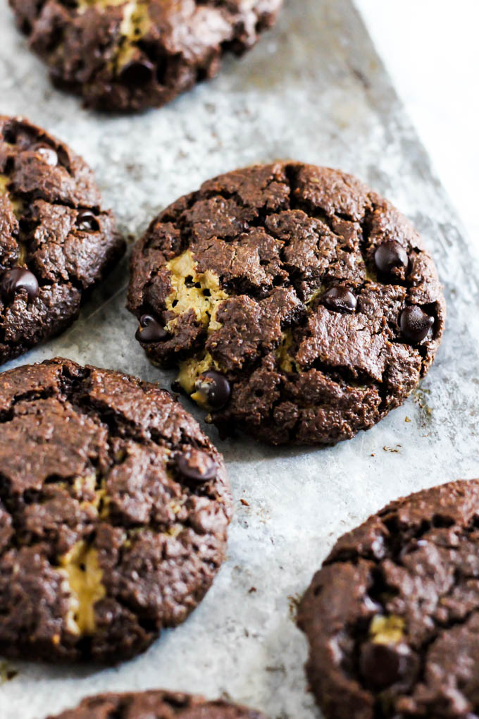 These gooey Stuffed Double Chocolate Chip Cookies are perfect treats to serve for a crowd! They're nut-free, vegan & gluten-free, so everyone can enjoy one.