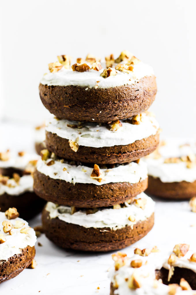 four gingerbread donuts stacked on top of one another