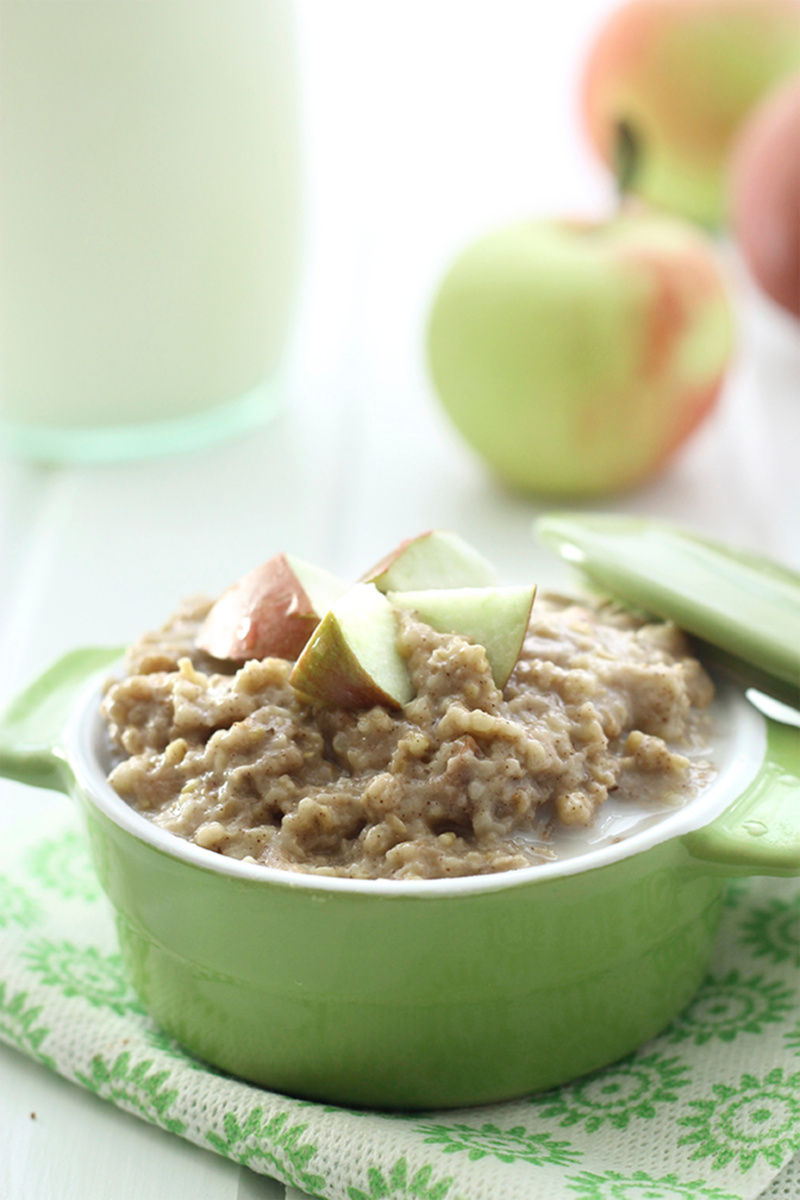 a green dish filled with apple pie oatmeal