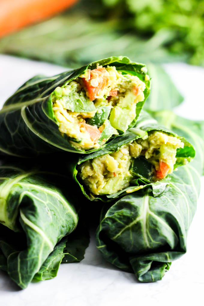 These Avocado Chickpea Salad Collard Wraps are perfect to pack for on-the-go! They're packed with fiber, protein & greens for a healthy lunch or dinner. Vegan & gluten-free!