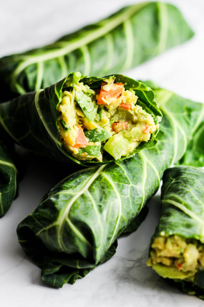 These Avocado Chickpea Salad Collard Wraps are perfect to pack for on-the-go! They're packed with fiber, protein & greens for a healthy lunch or dinner. Vegan & gluten-free!