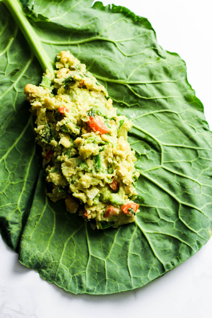 These Avocado Chickpea Salad Collard Wraps are perfect to pack for on-the-go! They're packed with fiber, protein & greens for a healthy lunch or dinner. Vegan & gluten-free!