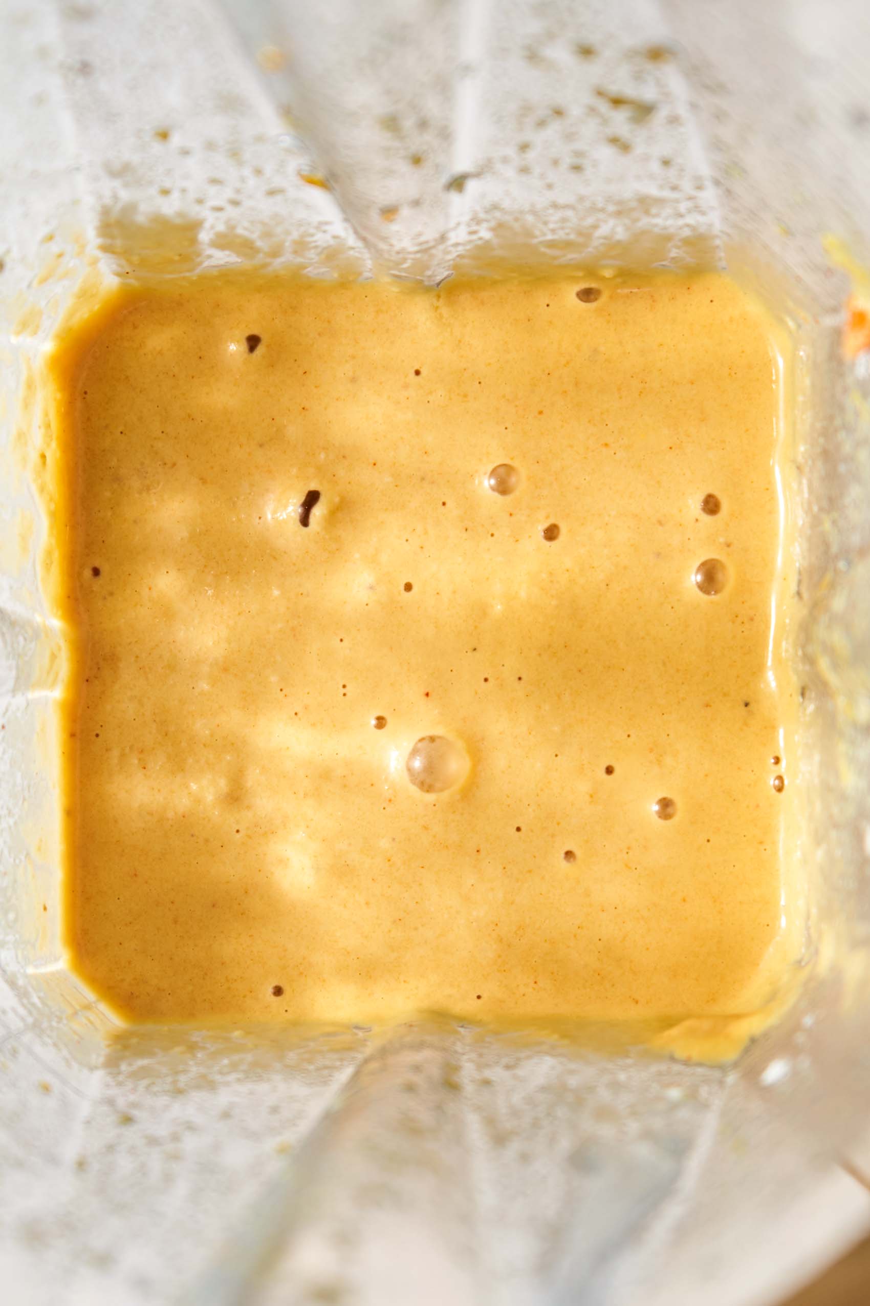 a blender of homemade vegan cheese sauce