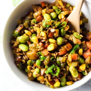 Easy vegetable fried rice that's done in 10 minutes and made with healthy, whole ingredients! This vegan & gluten-free meal is perfect for lunch or dinner.