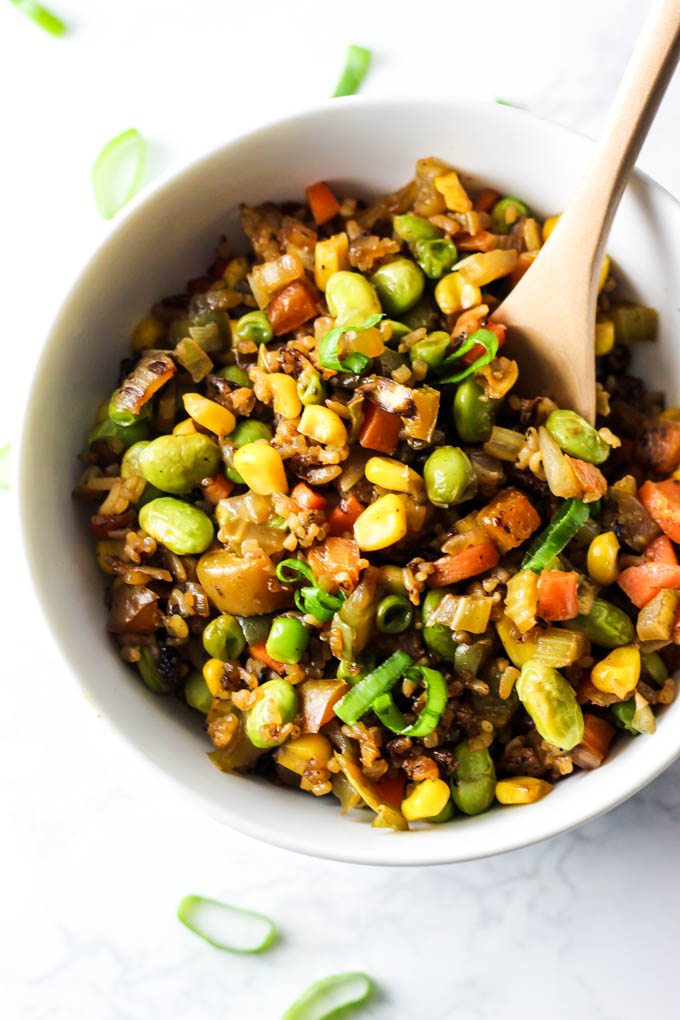 Easy vegetable fried rice that's done in 10 minutes and made with healthy, whole ingredients! This vegan & gluten-free meal is perfect for lunch or dinner.