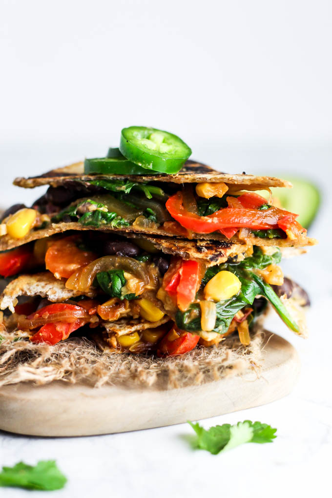 Enjoy this Vegan Quesadilla with Hummus & Vegetables for a healthy, flavorful meal or appetizer that is irresistible! Don't forget the guac. (gluten-free)