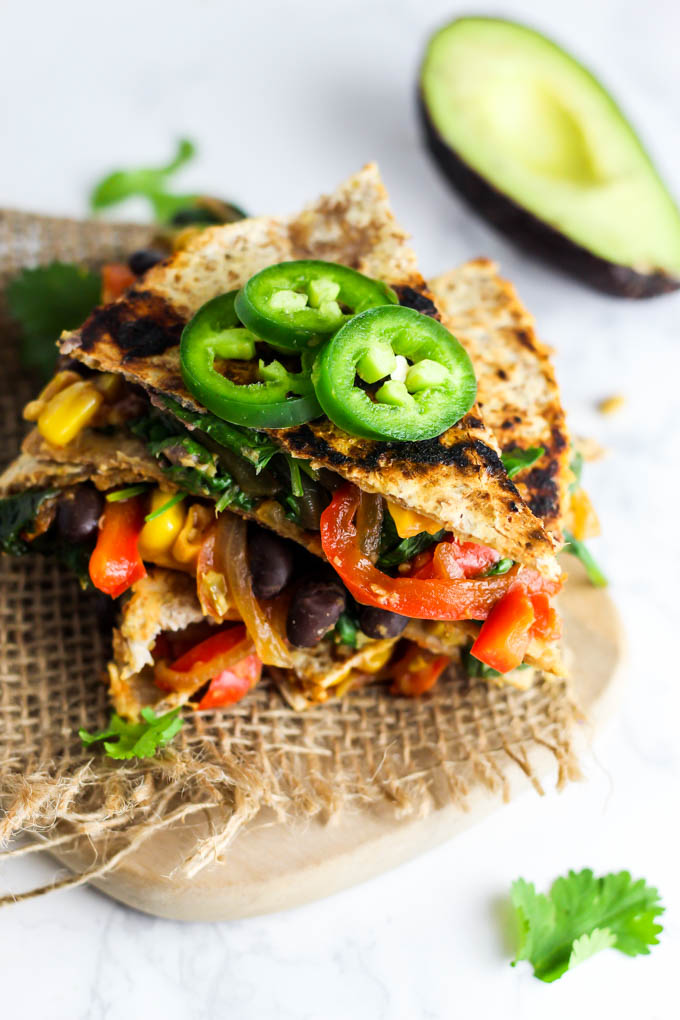 Enjoy this Vegan Quesadilla with Hummus & Vegetables for a healthy, flavorful meal or appetizer that is irresistible! Don't forget the guac. (gluten-free)