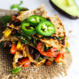 Enjoy this Vegan Quesadilla with Hummus & Vegetables for a healthy, flavorful meal or appetizer that is irresistible! Don't forget the guac. (gluten-free)