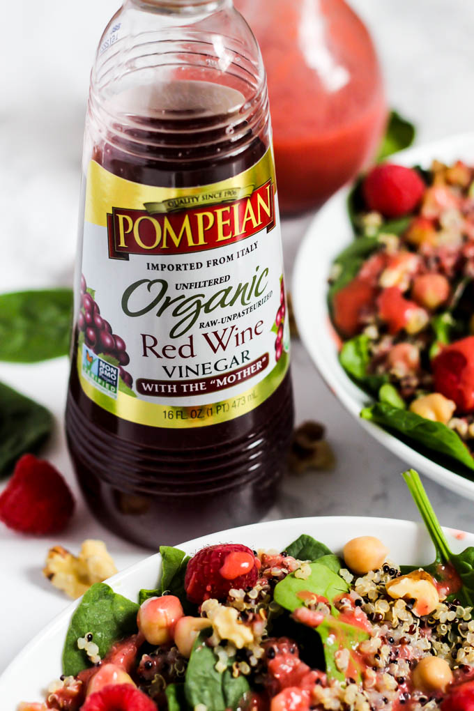 Enjoy the fresh flavors of the season with this fruity Quinoa Spinach Salad with Raspberry Vinaigrette! Serve it as a side or a meal. Vegan & gluten-free!