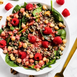 Enjoy the fresh flavors of the season with this fruity Quinoa Spinach Salad with Raspberry Vinaigrette! Serve it as a side or a meal. Vegan & gluten-free!