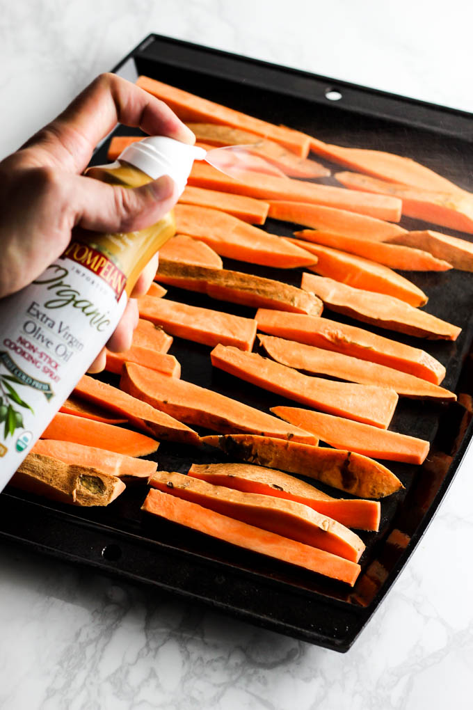 These extra Crispy Sweet Potato Fries dipped in tangy beet ketchup are the perfect addition to any dinner plate! A delicious vegan & gluten-free side dish.