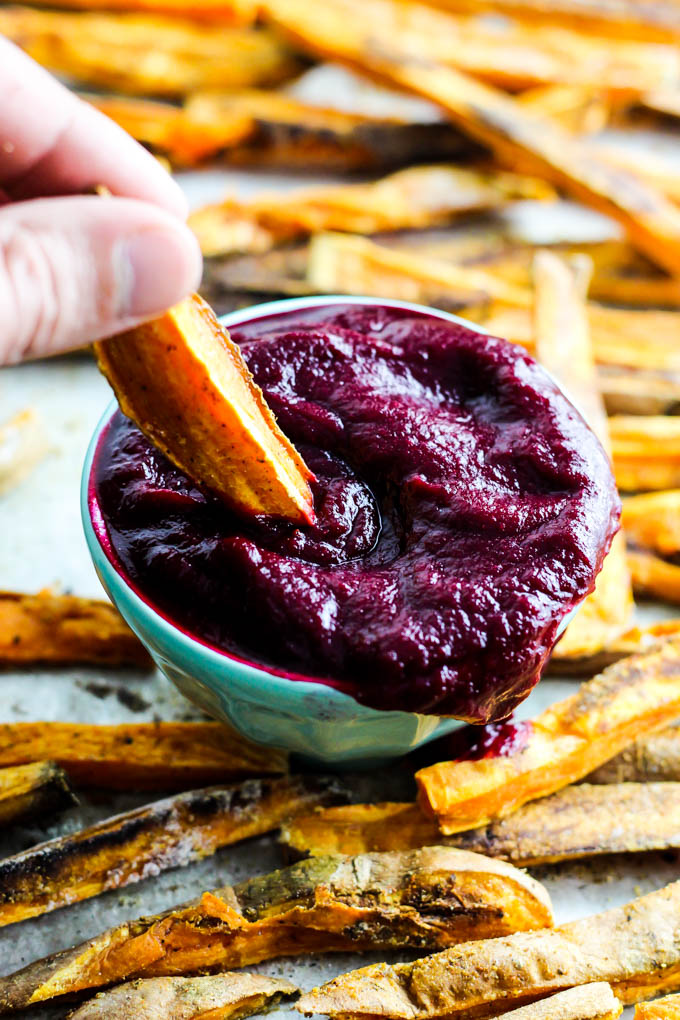 These extra Crispy Sweet Potato Fries dipped in tangy beet ketchup are the perfect addition to any dinner plate! A delicious vegan & gluten-free side dish.