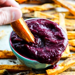 These extra Crispy Sweet Potato Fries dipped in tangy beet ketchup are the perfect addition to any dinner plate! A delicious vegan & gluten-free side dish.