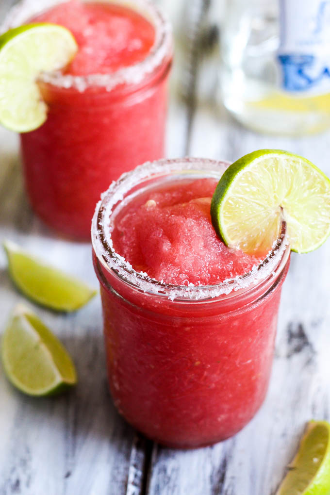 This Frozen Watermelon Margarita is your new go-to summertime drink! It's fruity, refreshing & made with only five ingredients. Perfect with chips & salsa!