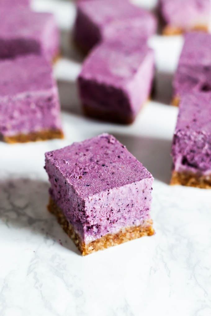 A perfect summer dessert, these No Bake Lemon Blueberry Cheesecake Bars are refreshing & full of fruity flavor! They're vegan, gluten-free & easy to make.