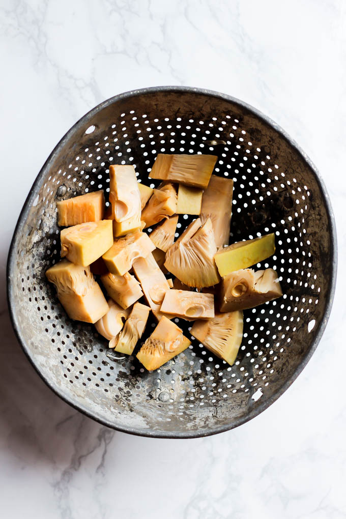 A strainer filled with drained raw canned jackfruit